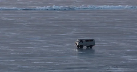 Passenger Van Rides On The Surface Of The Ice-covered Lake Stock Footage 104198246