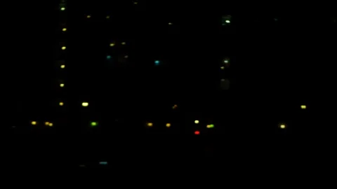 Passenger view through the window of train traveling slow at dark night. Stock Footage 120651970