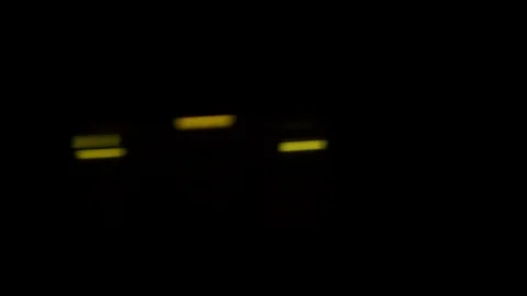 Passenger view through the window of train traveling fast at dark night. Stock Footage 120652009