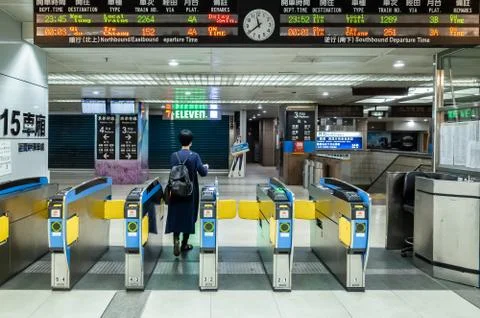Passenger walk through the gate at train station Stock Photos