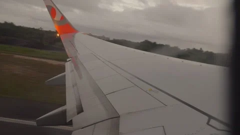  Passenger window view of a Gol Linhas Aereas airplane wing taxiing on runaway Видео 338185237