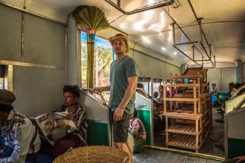 Passengers aboard the local circle train in Yangon, Myanmar Stock Photos