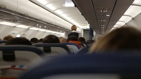 Passengers of the aircraft inside the cabin during the flight Video stock 120558302