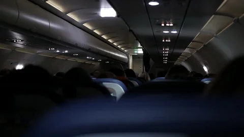 Passengers of the aircraft inside the cabin during the flight Video stock 120558397