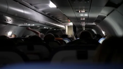 Passengers of the aircraft inside the cabin during the flight Video stock 120558505
