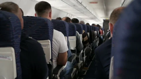 Passengers of the aircraft inside the cabin during the flight Stock Footage 120562844
