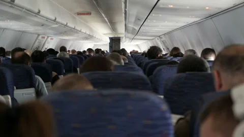 Passengers of the aircraft inside the cabin during the flight Stock Footage 120567209