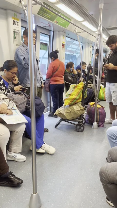 Passengers And Cargo Sacks Inside A Lima Metro Train Stock Footage 344767626