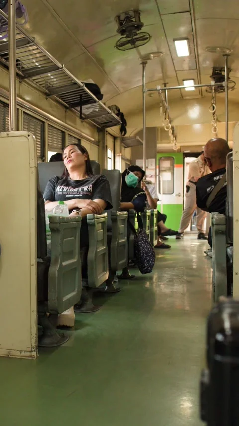 Passengers and Staff Inside a Moving Commuter Train in Bangkok Thailand Video stock 327629231