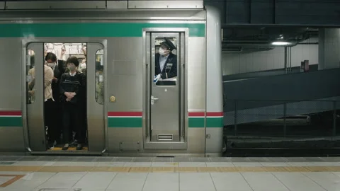 Passengers And Train Conductor Wearing Masks Inside A Train At The Station Stock Footage 158350343