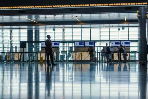 Passengers are checking before boarding the plane. Stock Photos