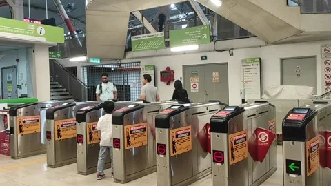 Passengers are passing the MRT gate Stock Footage 274768611