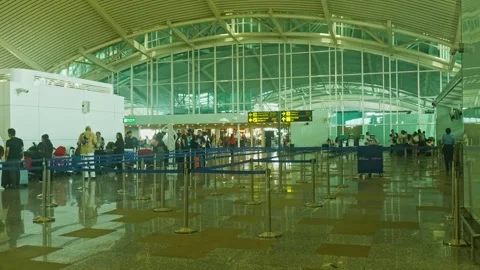 Passengers are waiting in queue for check-in near security disk at I Gusti Stock Footage 334134366