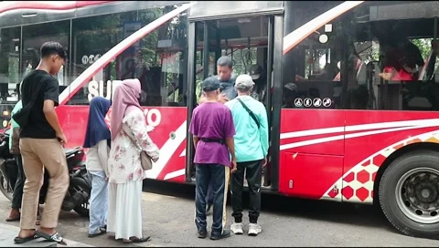. Passengers arrive and get off the bus Stock Footage 303570510