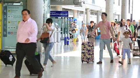 Passengers arrive at check-in counters International Airport. Bangkok, Thailand Stock Footage 60696071
