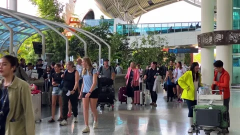 Passengers arrive in Denpasar Bali intl. airport, Indonesia, 4K Stock Footage 286909045