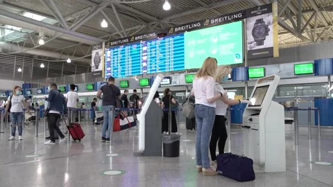 Passengers at the Athens Airport checking in Stock Footage 142844174