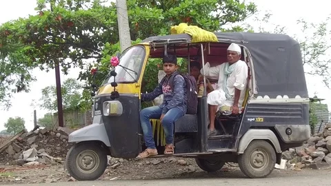 Passengers in the auto rickshaw Stock Footage 77572411