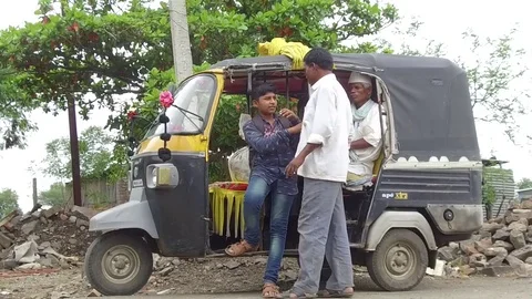 Passengers in the auto rickshaw Stock Footage 77572512
