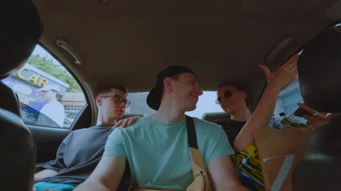 Passengers in the back row of the car, 3 passengers in the taxi Stock Footage 299026077