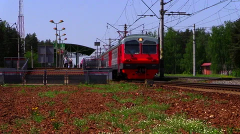Passengers board the commuter train approaching to the platform. Stock Footage 40668307