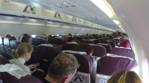 Passengers on board during flight, airplane interior long flying, click for HD Stock Footage 43965828