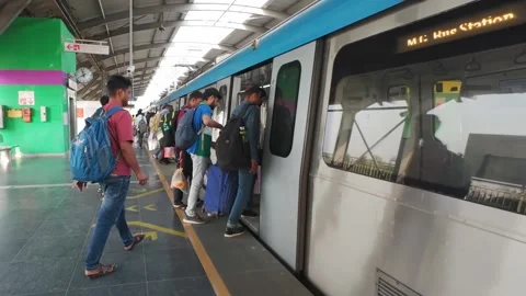 Passengers board subway train carriages at metro station in Hyderabad, India Stock Footage 310569741
