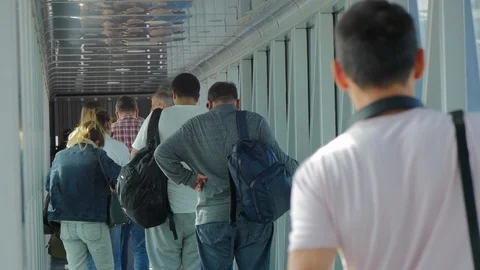 Passengers boarding an Airplane via Docking Sleeve Stock Footage 89413635