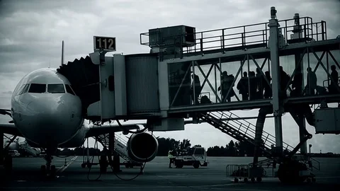 Passengers boarding on airplane through a jetway Stock Footage 81440129