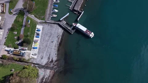Passengers boarding and leaving ferry aerial view Stock Footage 332370693