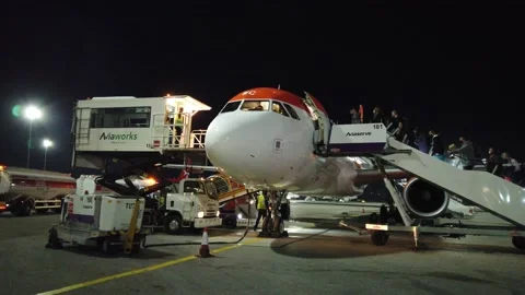 Passengers boarding Easy Jet flight from Malta to Manchester November 2021 Stock Footage 169454687