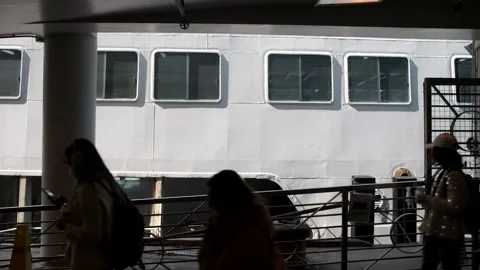 Passengers boarding ferry at the pier. Unrecognizable people. Stock Footage 229010189