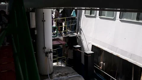 Passengers boarding ferry at the pier. Unrecognizable people. Stock Footage 229010417