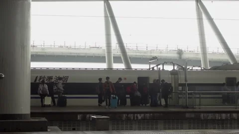 Passengers boarding a high speed train,4K Video stock 300191413