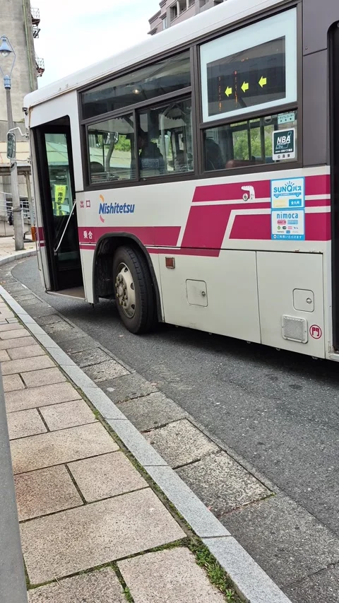 Passengers boarding a Nishitetsu commuter bus Video stock 337282391