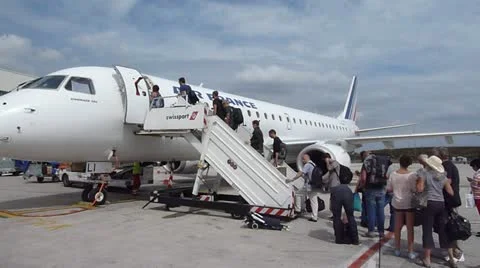 Passengers Boarding Plane at Charles de Gaulle Airport Stock Footage 11883075