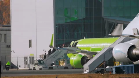 Passengers boarding a plane Stock Footage 164237942