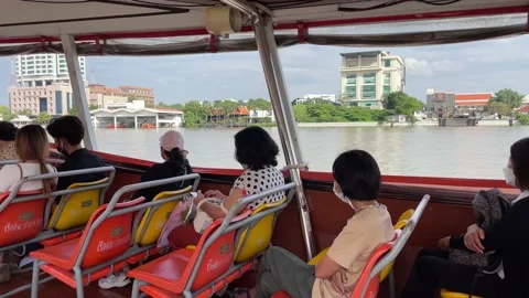 Passengers on boat commute with nice riverfront view. Women commuters sitting Video stock 171258338