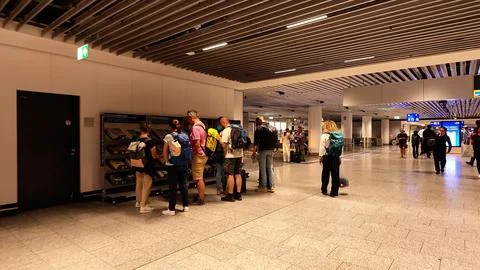Passengers Browsing Airport Reading Material Stock Photos