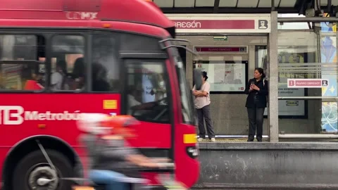 Passengers in a bus stop to board the Metro Bus, Mexico City, Mexico 4K Stock Footage 294941246
