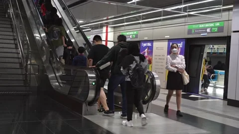 Passengers can seen taking escalators after they arrived their destination Stock Footage 239214717