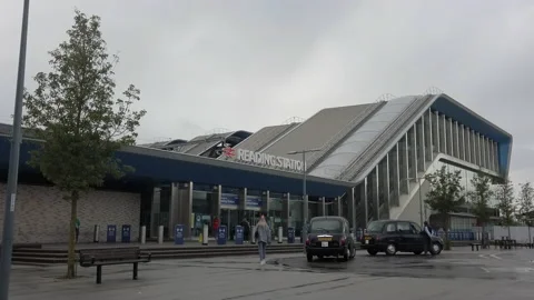 Passengers at the Caversham entrance to the main train station in Reading, UK Stock Footage 138396269