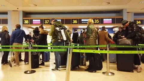 Passengers Checking in at an Airline Desk Stock Footage 100636410