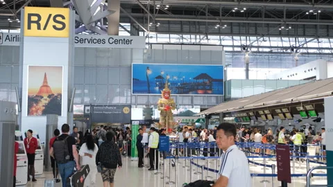 Passengers checking in at counters inside Airport Video stock 333102263