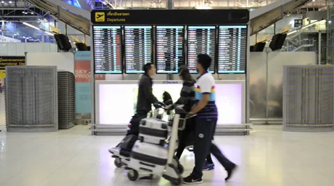 Passengers checking the flight schedule on airport charts Stock Footage 37688636
