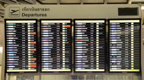Passengers checking the flight schedule on airport charts Stock Footage 39149086