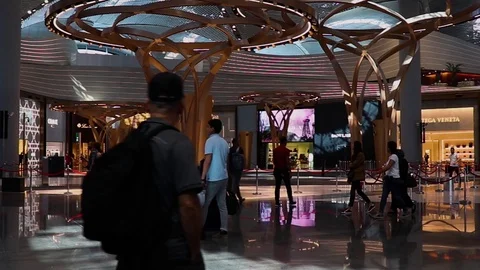 Passengers checking for their gate number on the digital screen Stock Footage 117166060