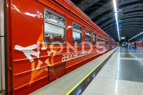 Passengers come to Kievskiy station by Aeroexpress train at night Stock Photos