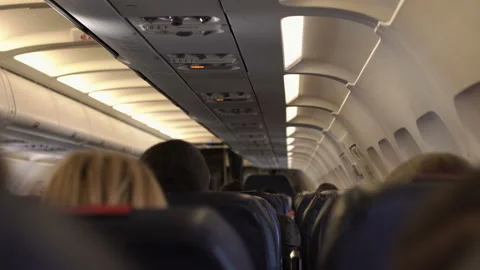 Passengers in comfortable seats of aircraft with the maps on screens in chairs Stock Footage 98290409
