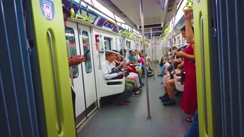 Passengers Commuting Inside Subway Train Using Mobile Phones in Buenos Aires Stock Footage 328524017